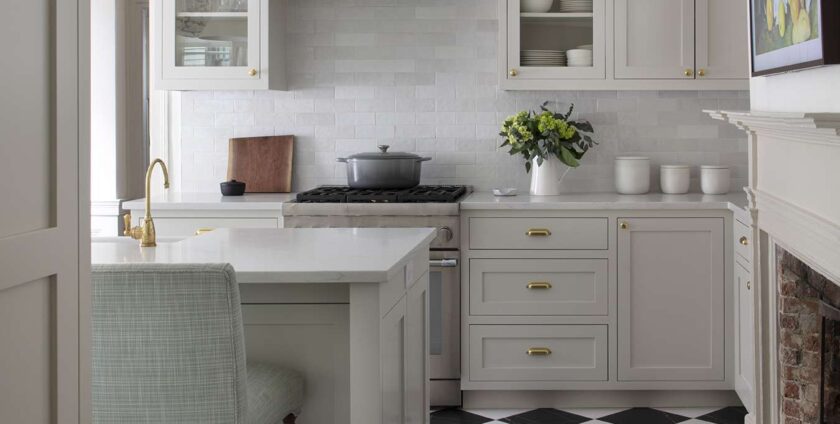 Elegant kitchen with soft gray cabinets and black-and-white checkered floor